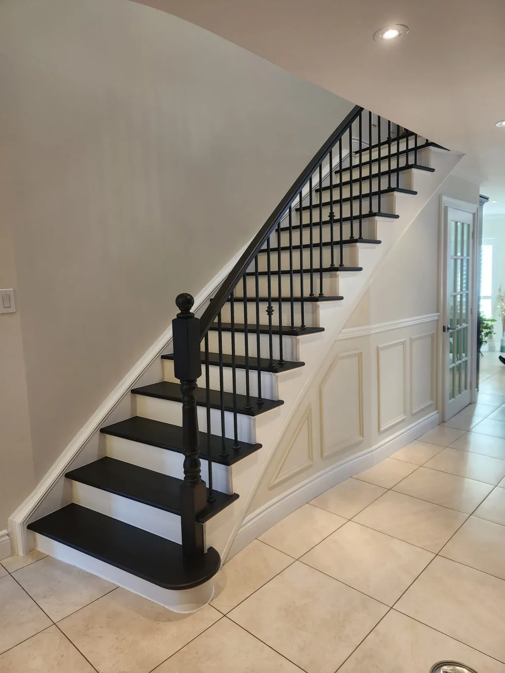 After — dark-stained, refinished hardwood staircase by Sigma Painting in Markham